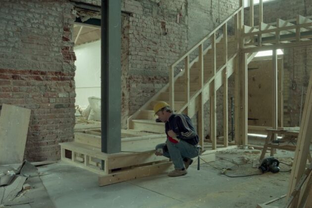 A contractor building the interior of the museum, the area which is now the foyer.